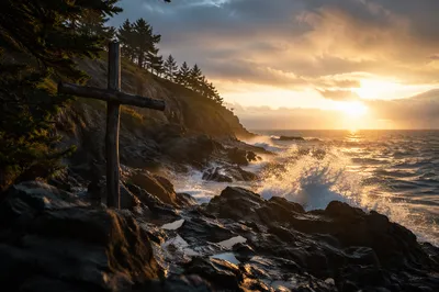 Driftwood Cross at Stormy Coastal Sunrise
