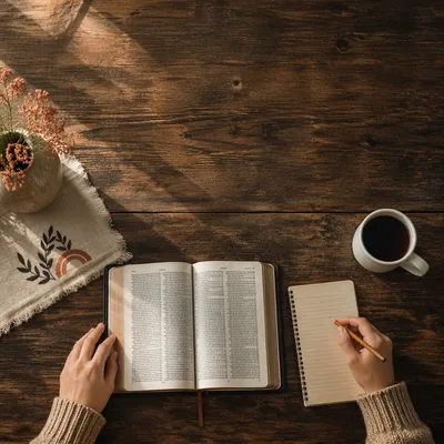Open Bible on Wooden Study Table