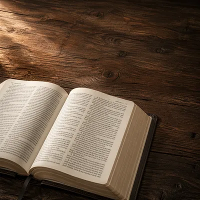 Open Bible on Walnut Table