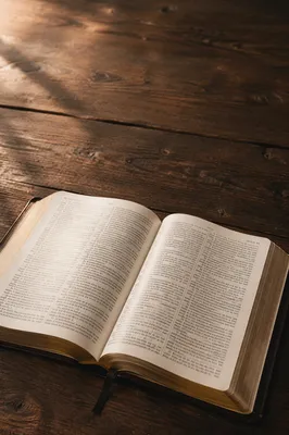 Open Bible on Walnut Table