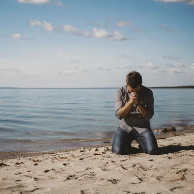 Solitary Prayer on a Peaceful Beach