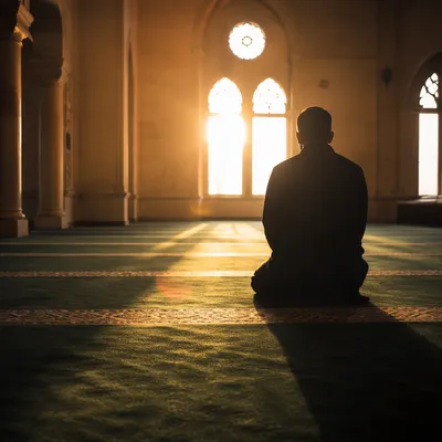 Silhouette Kneeling in Evergreen Chapel Prayer