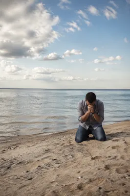 Solitary Prayer on a Peaceful Beach