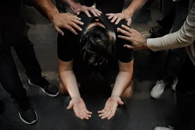 Overhead Prayer With Supportive Hands