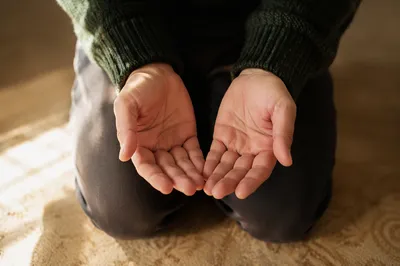 Quiet Kneeling Prayer with Open Hands