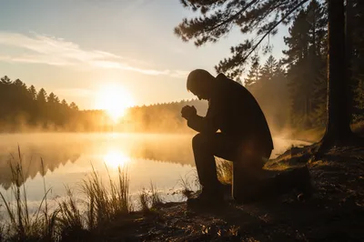 Kneeling Prayer at Misty Evergreen Lake