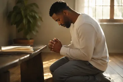 Young Man Kneeling in Sunlit Room