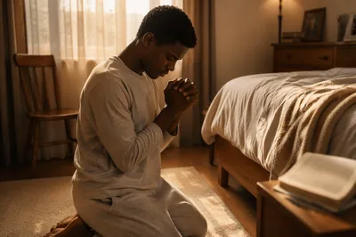 Young Man Kneeling in Prayer at Dawn