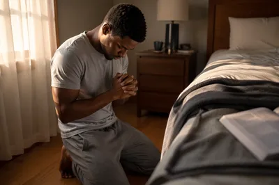 Young Man Kneeling in Prayer at Dawn