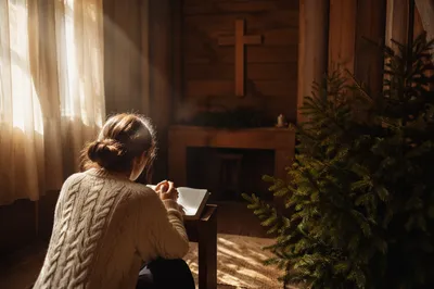 Kneeling Prayer in Evergreen Chapel Alcove