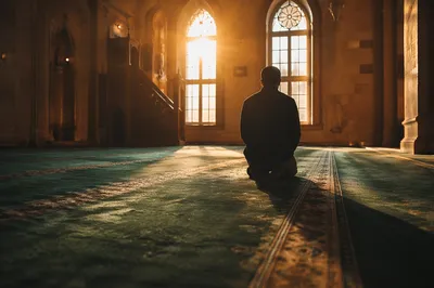Kneeling Prayer Silhouette in Evergreen Chapel