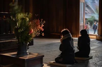 Two People Kneeling in Wooden Chapel
