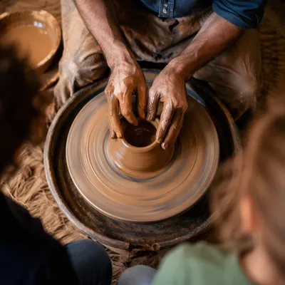 Potter Hands Shaping Wet Clay Vessel