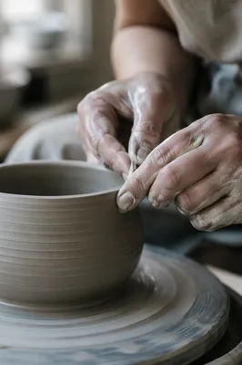Potter Hands Shaping Clay Vessel