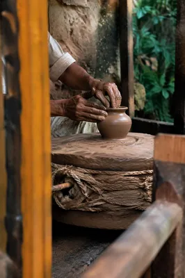 Potter Hands Shaping Clay Vessel