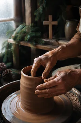 Potter Hands Shaping Clay in Prayerful Studio