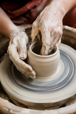 Potter Hands Shaping Clay Vessel
