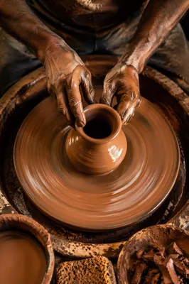 Potter Hands Shaping Clay on Wheel