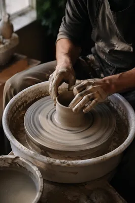 Potter Hands Shaping Clay in Studio