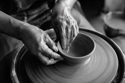 Potter Hands Shaping Clay Bowl