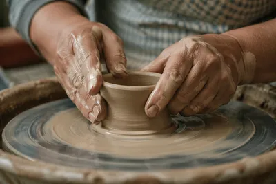 Potter Hands Shaping Clay Vessel