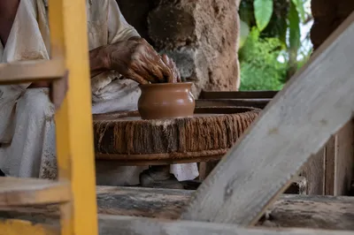 Potter Hands Shaping Clay Vessel