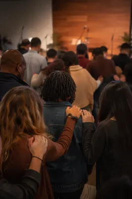 Diverse Prayer Group Holding Hands Together