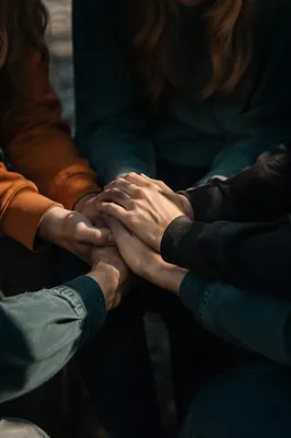 Prayer Group Hands Joined in Unity