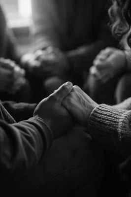 Joined Hands in Quiet Prayer Circle