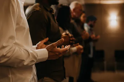 Prayer Group Hands Joined in Warm Fellowship