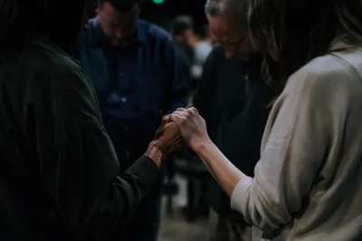Prayer Group Hands in Reverent Fellowship