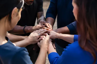 Diverse Prayer Group Hands Joined in Unity