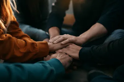 Prayer Group Hands Joined in Unity