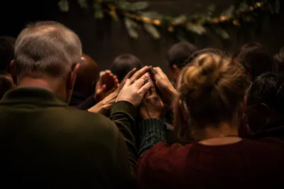 Evergreen Prayer Group with Joined Hands