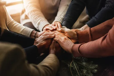 Prayer Group Hands in Warm Fellowship