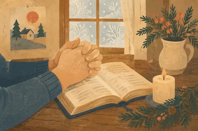 Praying Hands Over Bible with Evergreen