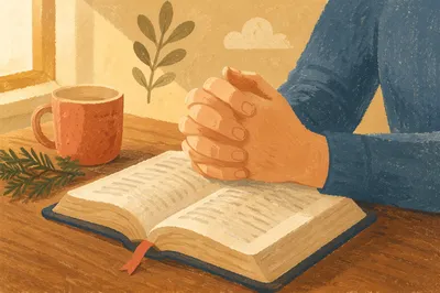 Praying Hands Above Open Bible