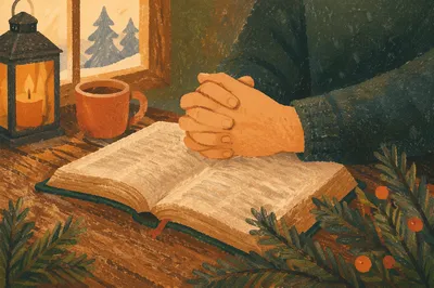 Praying Hands Over Bible with Evergreen