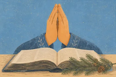 Praying Hands Over Bible With Evergreen Sprigs