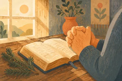 Praying Hands Beside Open Bible
