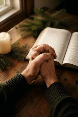 Praying Hands Over Open Bible Devotion
