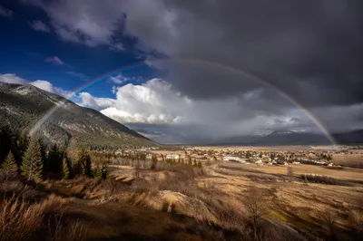 Hopeful Rainbow Over Mountain Valley