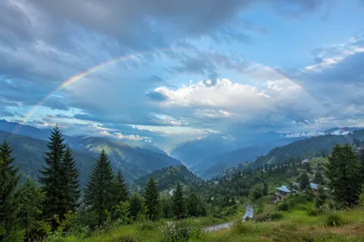 Hopeful Rainbow Over Evergreen Valley
