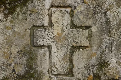 Weathered Limestone Cross with Moss Texture