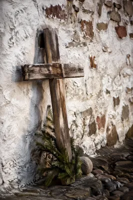 Weathered Wooden Cross with Evergreen Sprigs