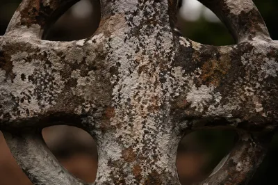 Rugged Weathered Stone Cross Texture Close Up