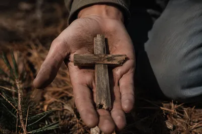 Rugged Wooden Cross in Weathered Palm