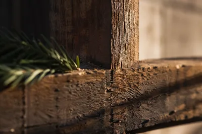 Rugged Wooden Cross Macro with Evergreen Needles