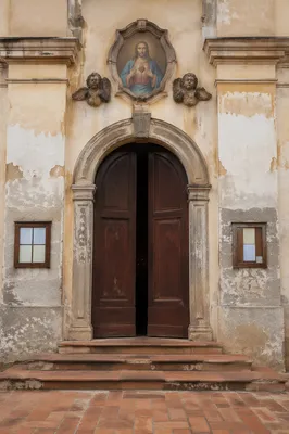 Historic Chapel Facade with Sacred Heart Plaque