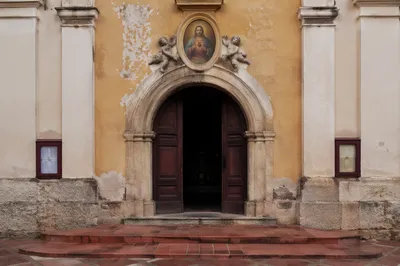 Historic Chapel Facade with Sacred Heart Plaque